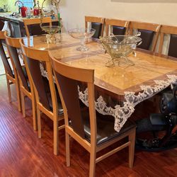 Brown wooden table with 9 chairs