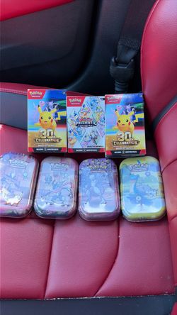 2 30th booster boxes 1 prismatic booster box 4 30mini tins