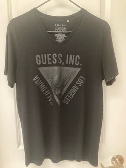 Black Guess v-neck tee in size Medium with a tonal 'Guess, Inc. Los Angeles California' triangle graphic on the front.