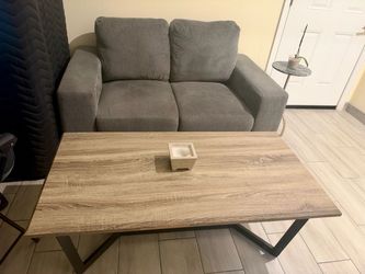 Small sofa with tables and lamps