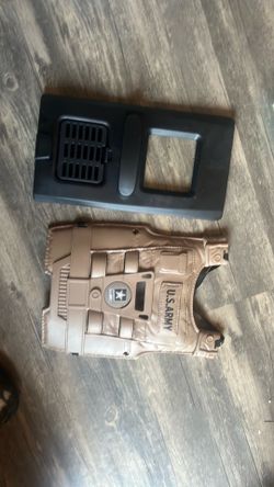 Child’s toys, military vest, and shield