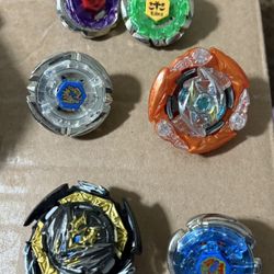 Lot Of Beyblades And Launchers
