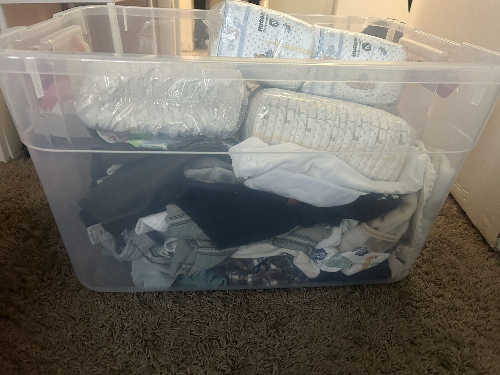 Bin Of Newborn& 0-3 Clothes And 3 Packs Of Newborn Diapers