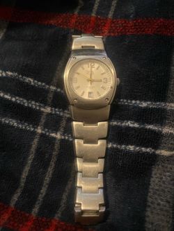 Caterpillar stainless steel wristwatch with a rectangular case and white dial.