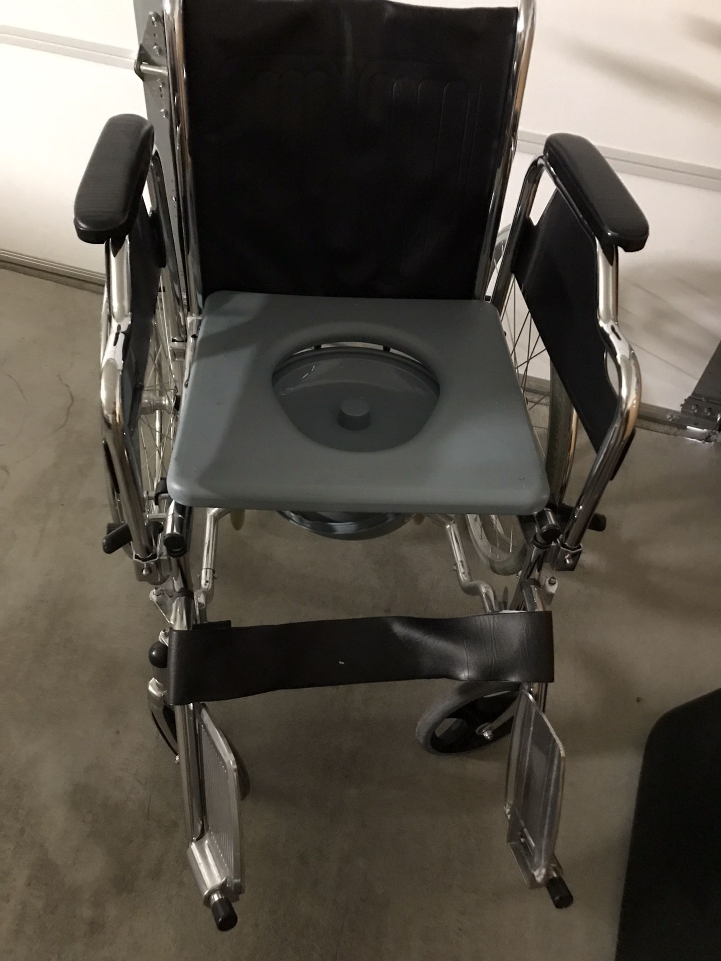 Wheelchair/elderly stroller with plastic bucket toilet. Foldable.