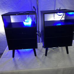 matching pair set of black small nightstands with LED and usb/power connection on top