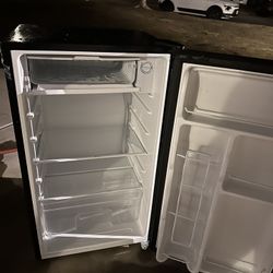 mini fridge with freezer still almost new plastic sitll on