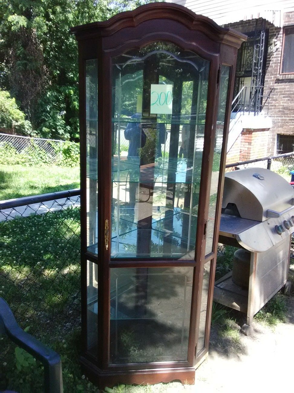 Corner curio cabinet with light and glass shelves 7ft high