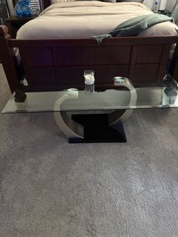 Bowery Hill Modern Glass Top Coffee Table in Satin Silver with Black Glossy Base