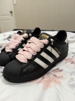 Black superstar adidas with pink thick laces 