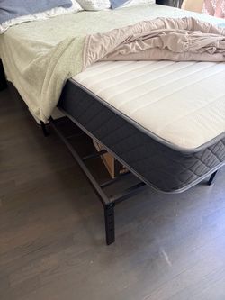 New Queen Mattress and frame.