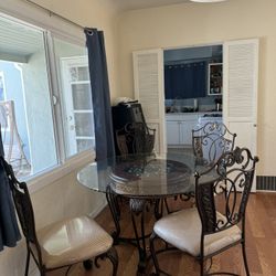 glass table with 4 chairs