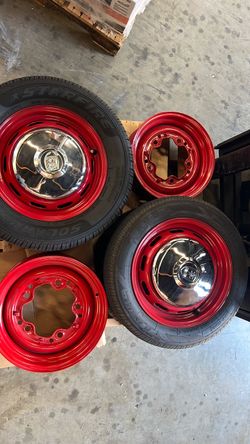 Red Steel Wheels with Chrome Center Caps and Tires