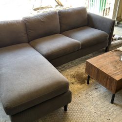 Living Spaces AYA GREY SOFA WITH REVERSIBLE CHAISE   Bought for 