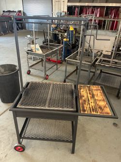 Metal BBQ with front wheels or make an offer