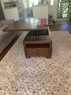 Lift-top wooden coffee table with storage