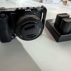 Sony ZV E10 Mirrorless Camera w/ 16 to 50mm Lens, Cage, 3 Batteries