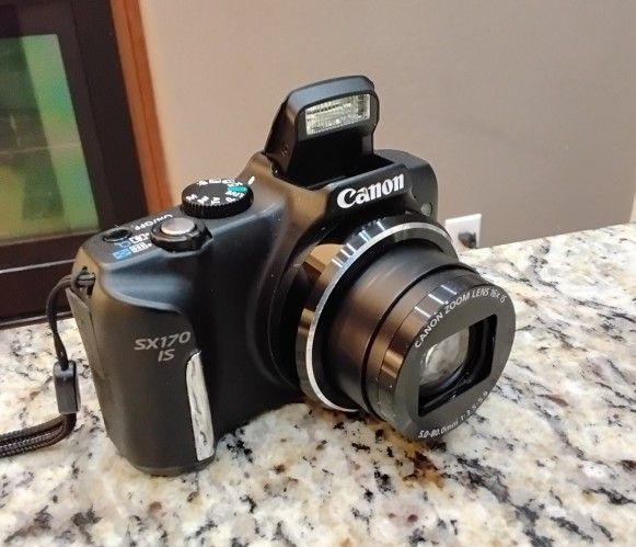 Canon PowerShot SX170 IS 16 Mega Pixel Digital Camera With Rechargeable Battery And Charger