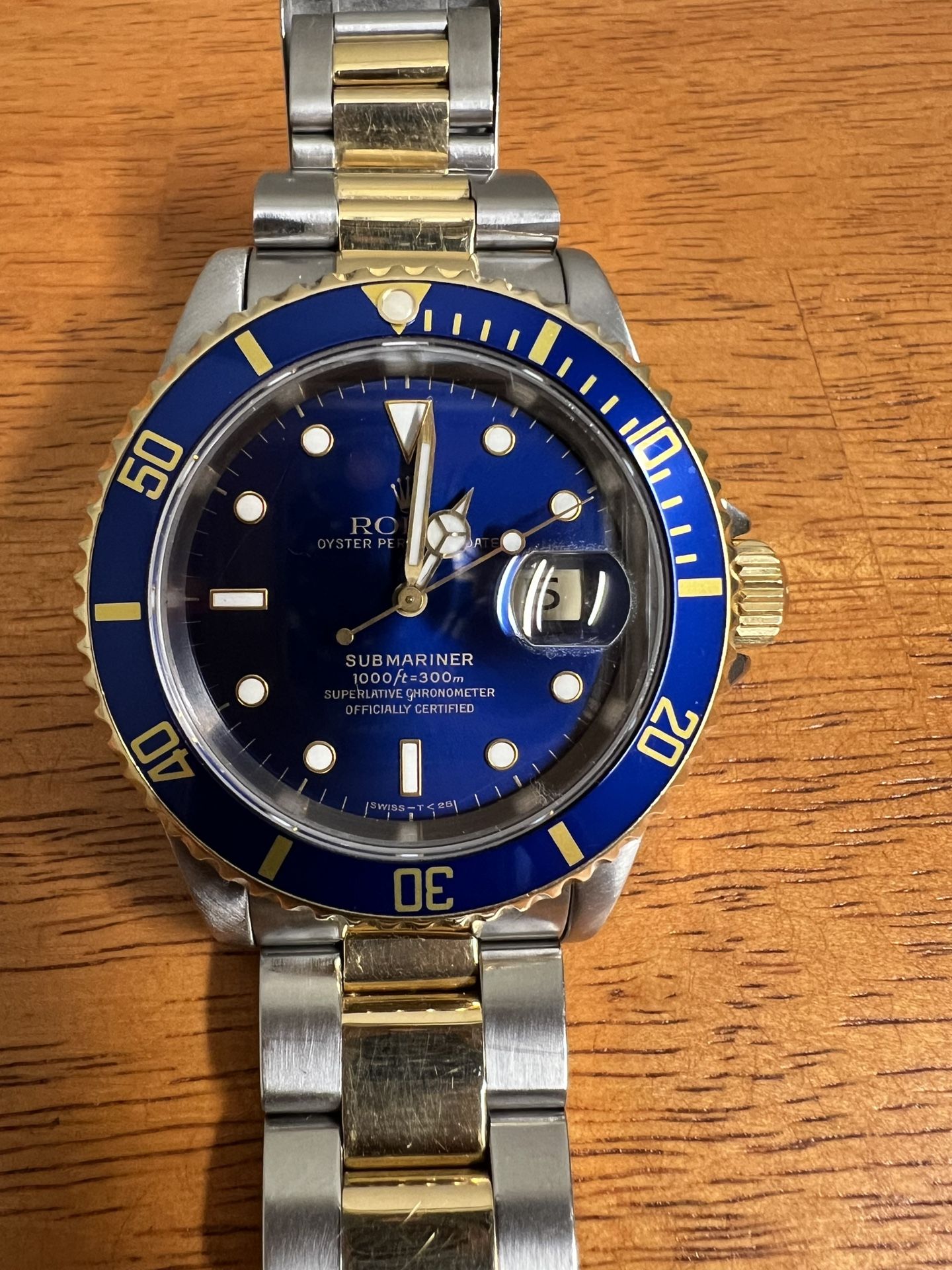 Rolex submariner two tone 42 mm preowned Certified watch  (model year-1993-94 )in 18 Karat yellow gold and stainless original bracelet blue dial , com