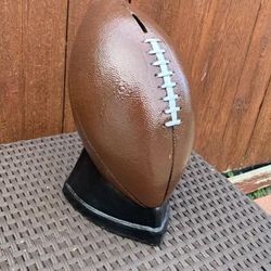 Football coin, bank statue