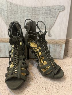 🚨SERIOUS BUYERS ONLY!  Olive Green Caged Gladiator Size 6.5 heels are a stylish shoe choice featuring a lace-up front and open-toe design.  Excellent