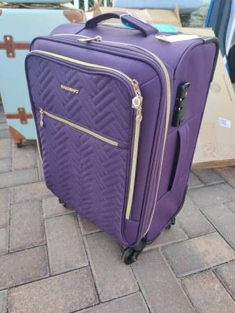 Purple carry-on luggage with tote bag