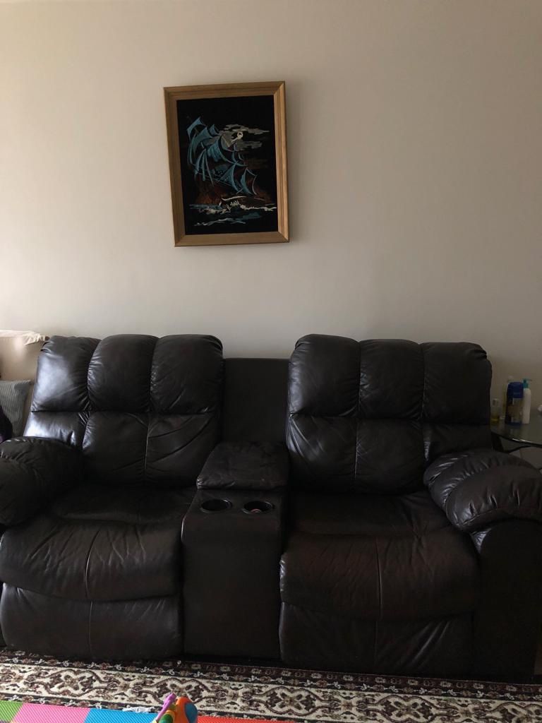 Ashley pure leather reclining sofa and reclining loveseat in great condition.