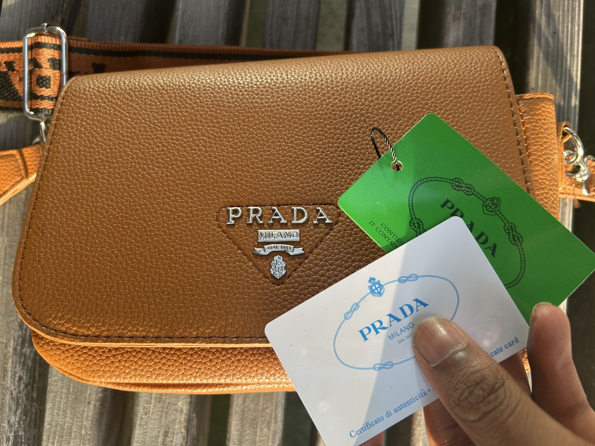 Prada logo-plaque leather shoulder bag