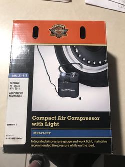 Air compressor tire gauge and suspension pump