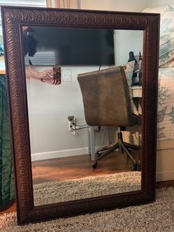 Large, dark mahogany mirror