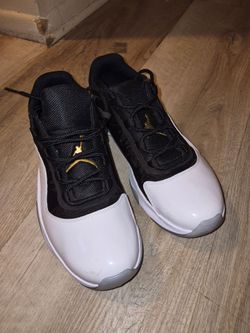 Air Jordan 11 Low Black White Gold Sneakers