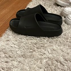 Black Nike slides