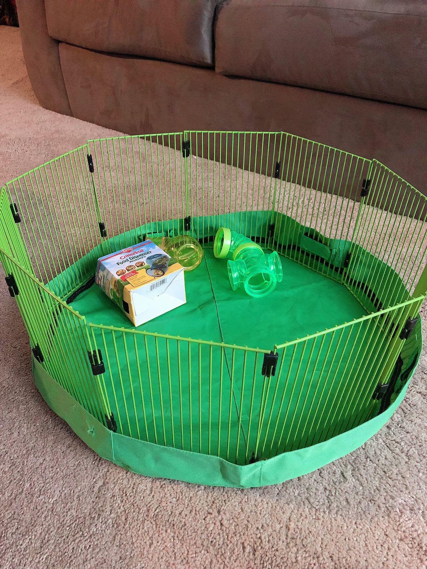 Brand new. NEVER used critter cage with food dispenser.