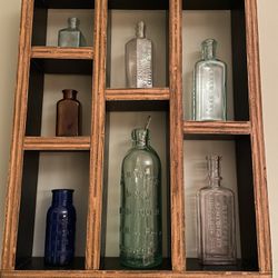 7 Antique Pharmacy Bottles With Wood Shelf