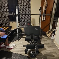 MARCY  DIAMOND  ELITE WORK OUT BENCH  A ND. WEIGHTS