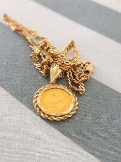 14 k Gold chain + 22 k Krugerrand coin pendant