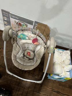 Portable Swing And 65 Born Pampers