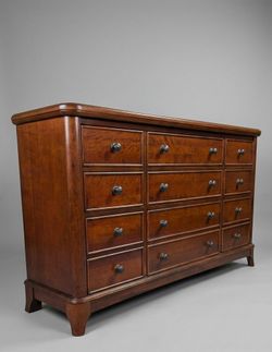 64"L 18"W 38"H heavy Beautiful and sturdy 9-drawer solid wood dresser in good condition