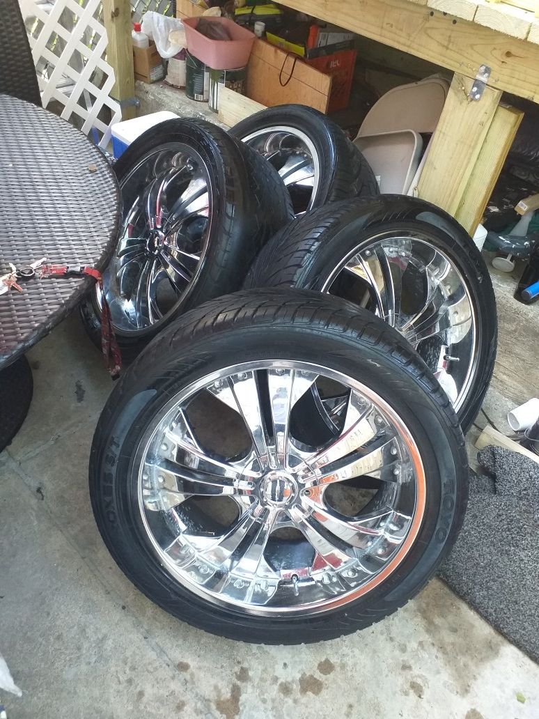 23 inch rims with tires that still look new asking for $500 best offer