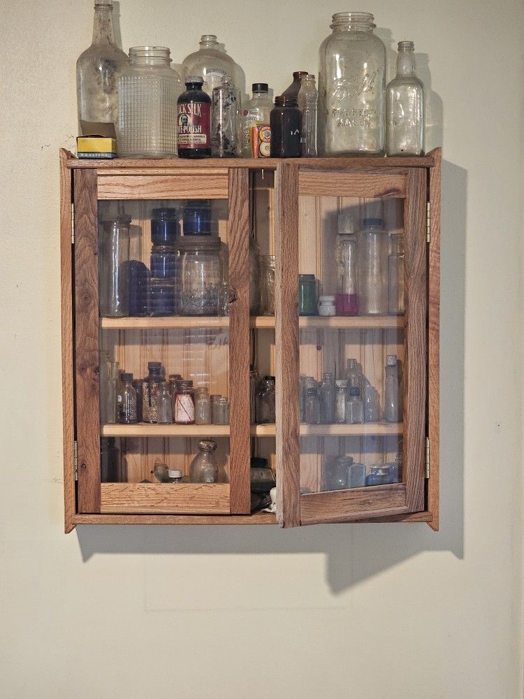 Old Cabinet With Older Bottles
