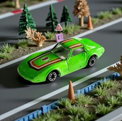 Yatming Green Chevrolet Corvette Stingray C3 Generation T-Top Die-Cast 1:64 Car. Model Details: The vehicle is a 1:64 scale reproduction of a Chevrole