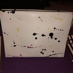 Henri Bendel paint splatter clutch