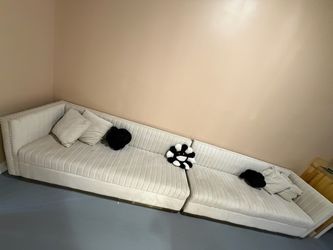 Cream sofa with gold accents