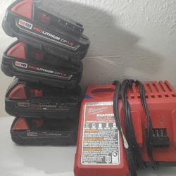 4 Working 18v Milwaukee Batteries With Charger 