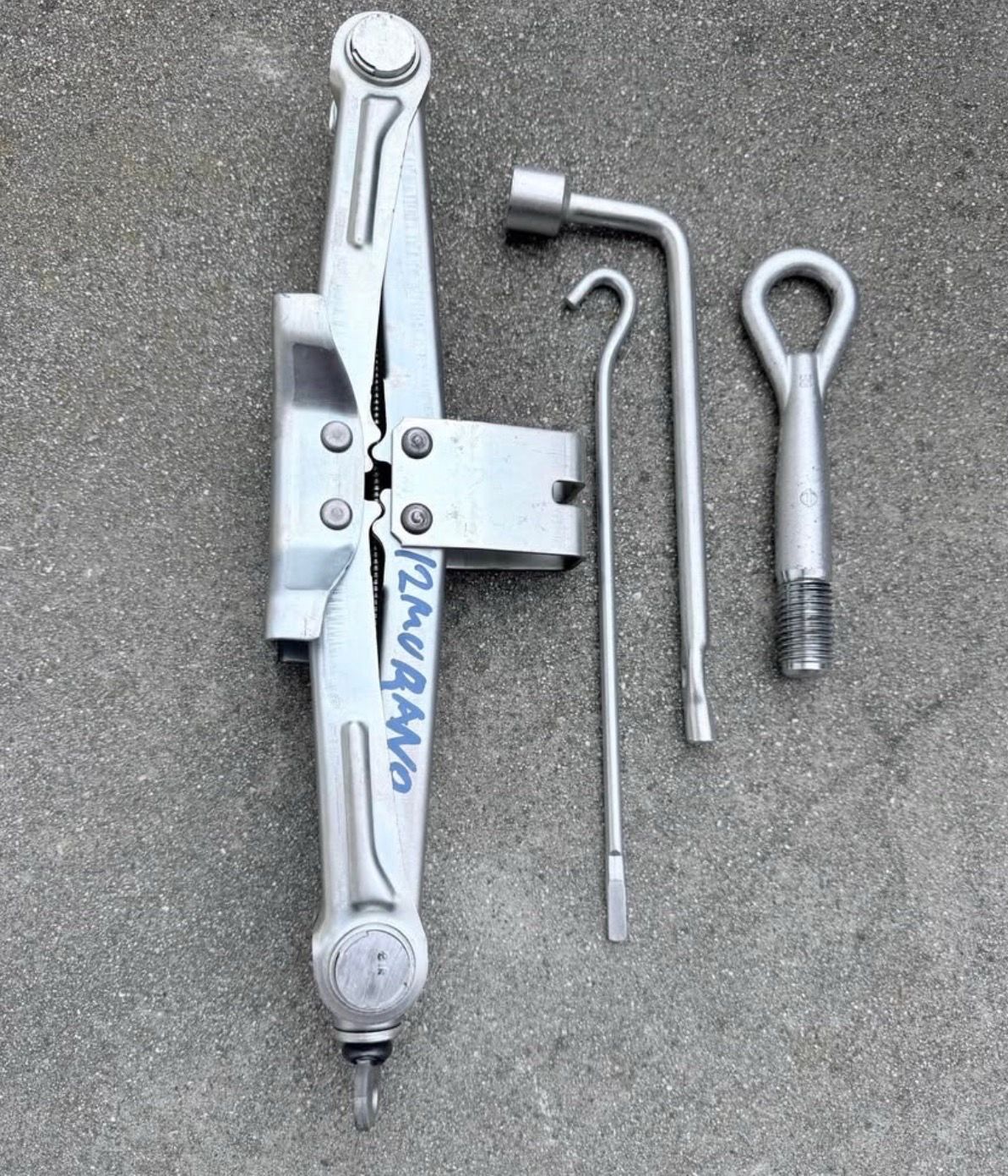 2012 Nissan Murano OEM Emergency Spare Tire Jack & Tool Kit – Complete 4-Piece Set