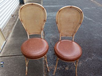 Two Metal Wicker And Ratan Style Chairs.
