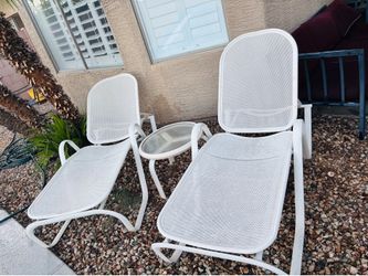 White lounger chairs and tables