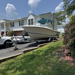21’ Stratos Dual Console Boat with 200HP Johnson Motor and Trailer