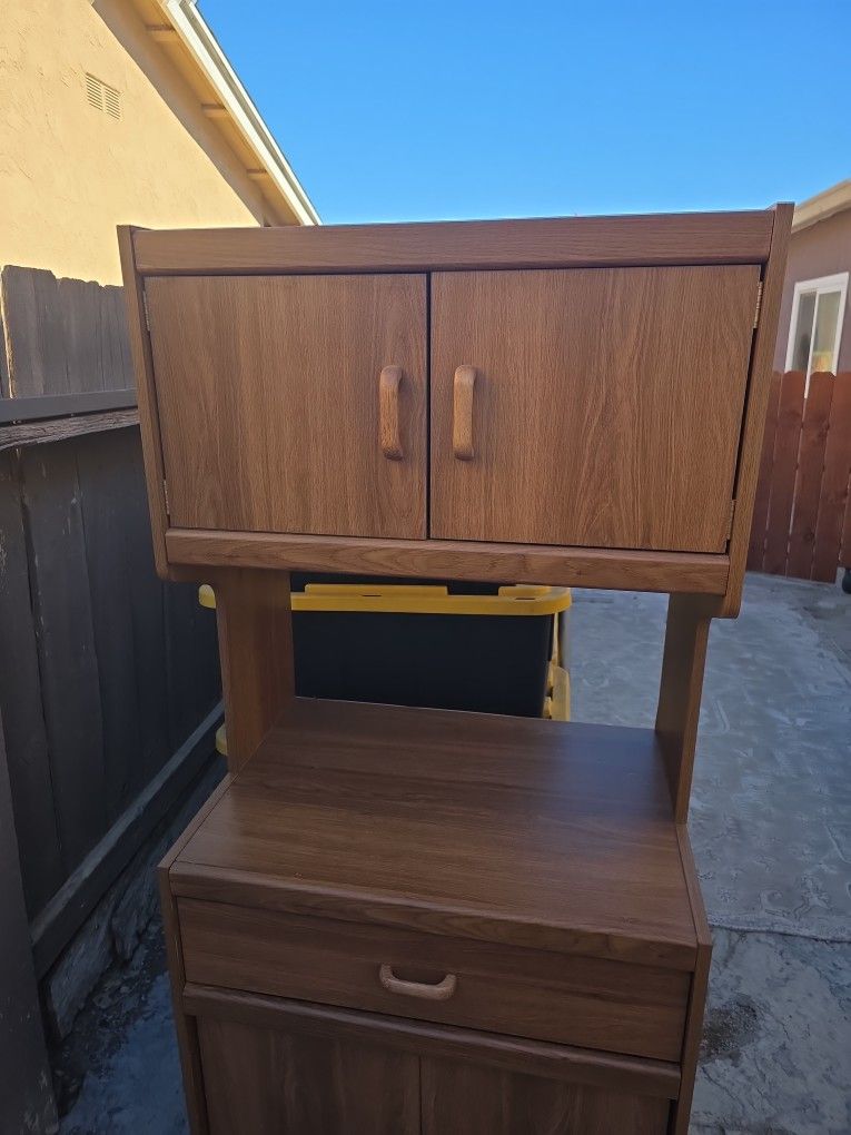 Several Storage Compartment Wood Stand Witn Wheels