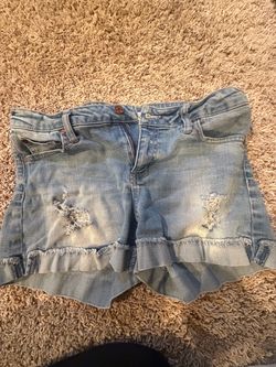 Light Wash Distressed Denim Ruffle Shorts